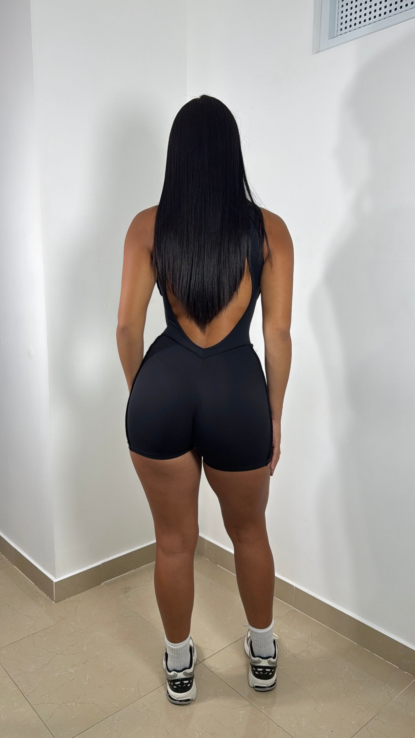 Emboired short black jumpsuit
